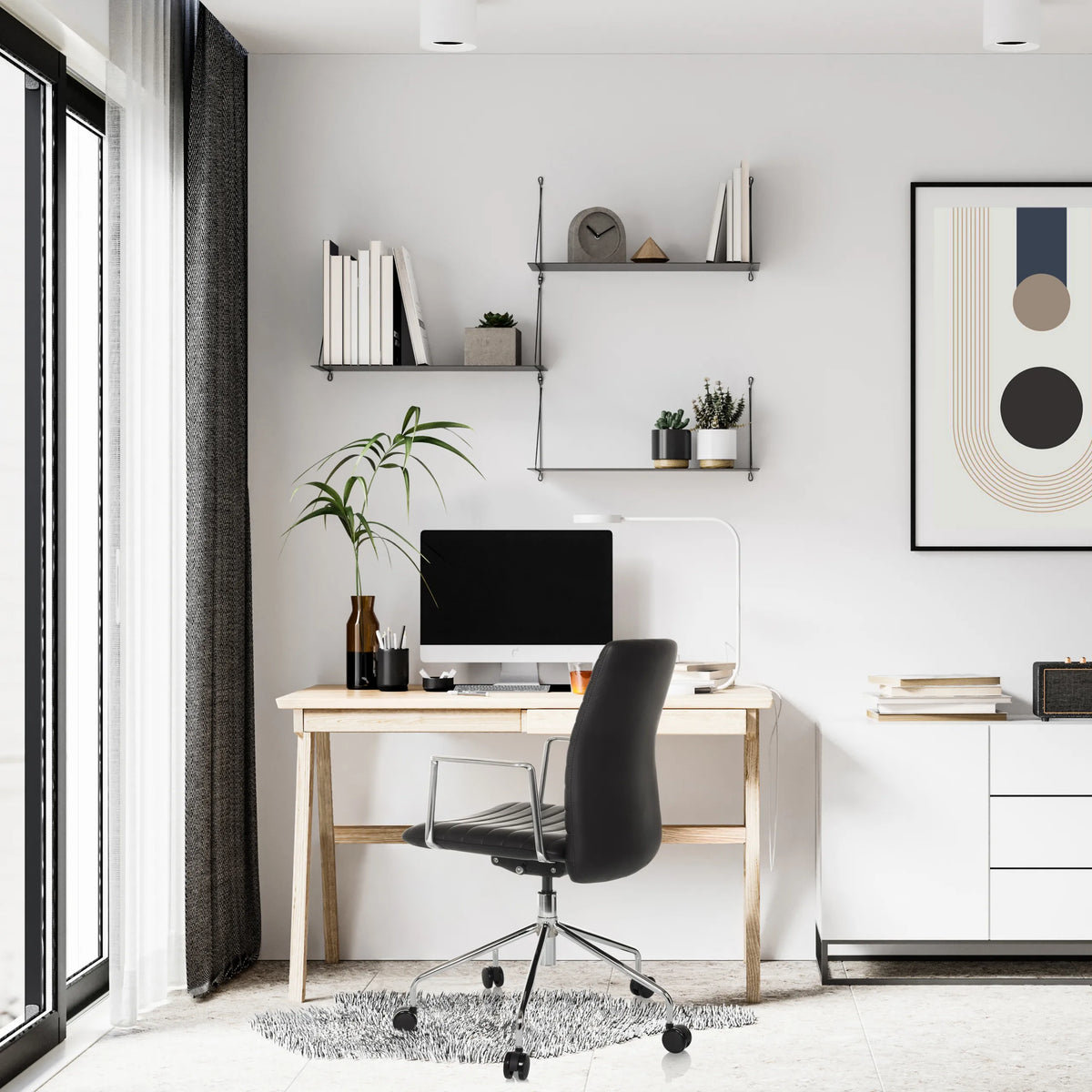 Luksus-chefstol VEMONA 30 i sort med armlæn og hjul ved et skrivebord fra hjh OFFICE