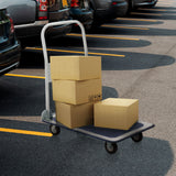Blå-hvid platformsvogn CARRY med tre lastede papkasser på en parkeringsplads fra hjh OFFICE