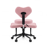 Rückansicht des rosa Meditationsstuhls Asanasit mit herzförmiger Rückenlehne und schwarzem Fußkreuz von hjh LIVING