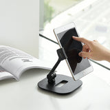 Sort holder til mobiltelefon & tablet FLEXMOBI IV med en indsat tablet på hvid baggrund fra hjh OFFICE