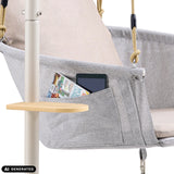 Sidelomme med tablet og magasin på Skylo hængestol inklusiv et lille sidebord fra hjh LIVING (AI-genereret billede)